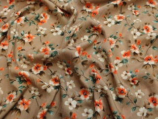 Tkanina wiskoza wzorzysta beżowa kwiaty pomarańczowe